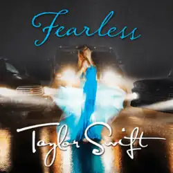Cover artwork of "Fearless", showing Swift standing in the rain as car headlights shine on her