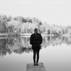 Cover art of "No Body, No Crime", showing Taylor Swift standing in front of a lake