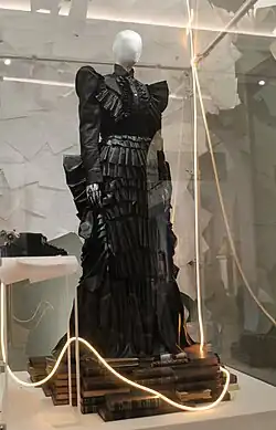 An exhibit of a black Victorian-gothic gown