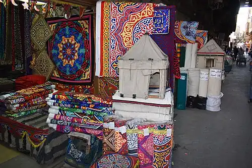 Shops along the Street of the Tentmakers, in the Qasaba of Radwan Bey, selling khayamiya textiles.