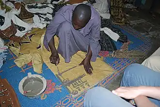Image 19A textile artisan at work in Djenne, Mali. (from Culture of Mali)