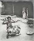Krobo girl dressing her hair, late 19th century