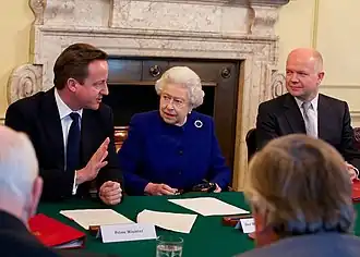 Elizabeth II, Queen of the United Kingdom, with her Cabinet, a subcommittee of the Privy Council, at 10 Downing Street, 18 December 2012