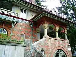 Neo‑Brâncovenesc balcony.