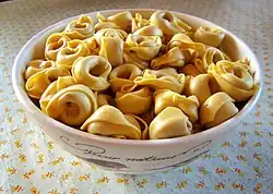 Industrially-made tortellini, easily recognizable for the extremely regular cut of the dough and the symmetrical closing of the extremities
