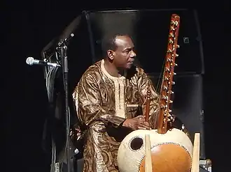 Griot Toumani Diabate on stage in concert with his kora