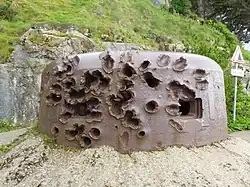 Colour photograph of a badly damaged metal structure