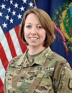 2021 head and shoulders color photo of Brigadier General Tracey Poirier as a colonel, in Operational Camouflage Pattern uniform, facing slightly to her right, looking front