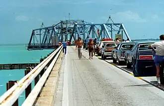 Traffic waiting for the open swing span over Moser Channel.