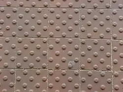 A grid of tiles, each with a grid of bumps on them