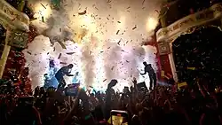 Twenty One Pilots performing on stage for a live audience
