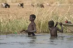 Children fishing in Lake Maga.