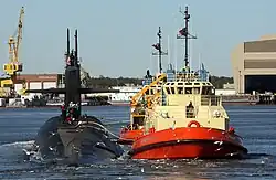 USS Rhode Island (SSBN-740) being escorted by tug boats to Kings Bay.