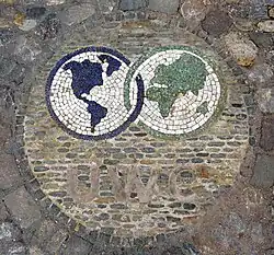 The UWC logo created using mosaics on the floor.