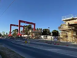 Two red gantry cranes
