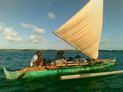 A modern undecorated tondaan or bogo-lamak without the prow and stern extensions and with a plain sail from the Bajau of Sabah