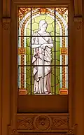 Stained glass portraying the goddess Themis, symbol of justice in the Jury Room