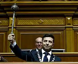 Volodymyr Zelenskyy lifting presidential bulava during the 2019 presidential inauguration of Ukraine