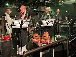 Mokugyos on stage, Yotsuya, Japan