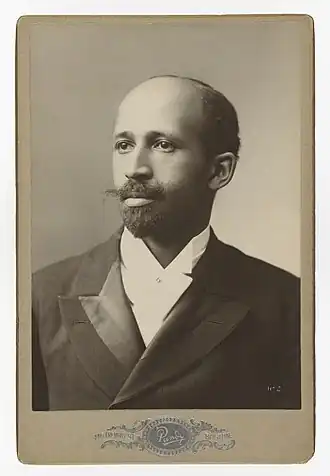 Formal portrait photograph of an African American man, wearing a suit