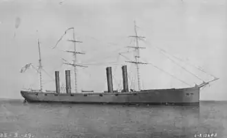 USS Wampanoag at sea, with her long hull detailed by cannons. She has 4 funnels and 3 main masts and a spar, which has been drawn into the image.