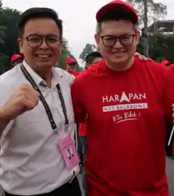 Ong and Member of Parliament (MP) for Bandar Kuching Kelvin Yii Lee Wuen standing, smiling and making fists in Selangor, Malaysia on the Nomination Day of the 2023 Selangor state election on 29 July 2023.