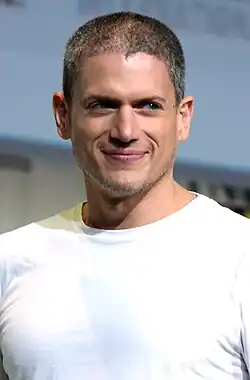 Wentworth Miller standing at a Comic-Con panel