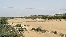 The dried up riverbed of the Winder River, seen from the N-25 National Highway.