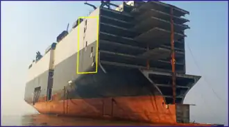 Window cut for ventilation and illumination of hull[78] during ship recycling