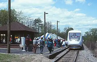 A silver passenger trainset with "Amtrak" written below the cab windows