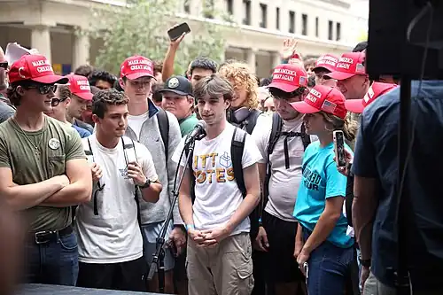 Young Americans, seen here with Make America Great Again (MAGA) hats at a 2024 event, have been moving towards the political right since 2020.