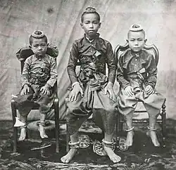 Photograph of Prince Chulalongkorn (Rama V) and his two younger brothers wearing chong kraben in 1851