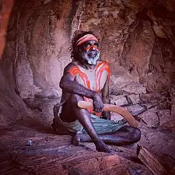 A Yuendumu man holding a boomerang, photographed in 2017 by Ed Gold