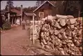Cull logs stacked for sale at Big Moose, 1973