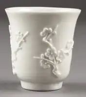 Chinese Dehua porcelain cup with prunus blossom, 17th century